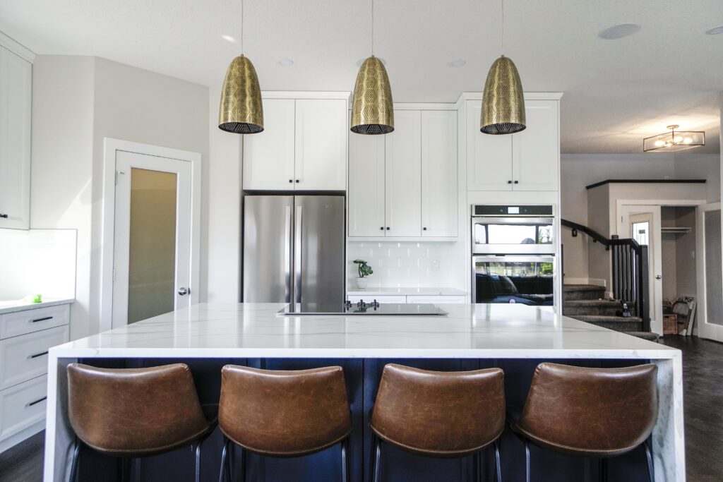 its a kitchen in living room with dining table  